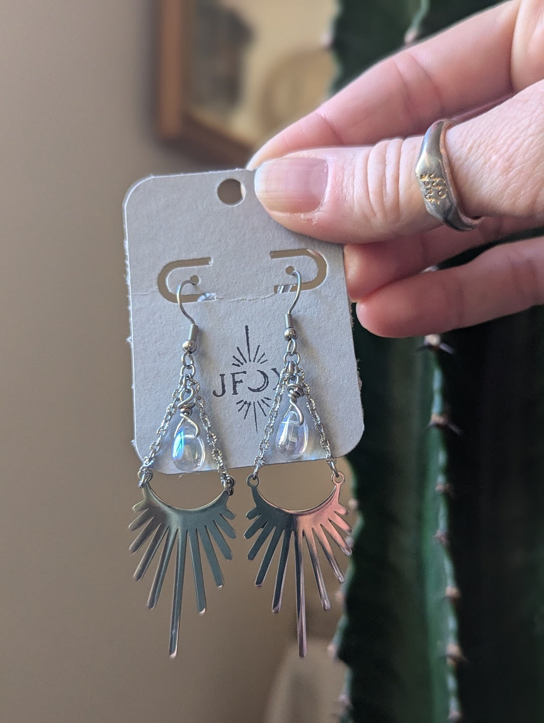 Rayo de sol con detalles en forma de lágrima de cristal (plata o dorada)