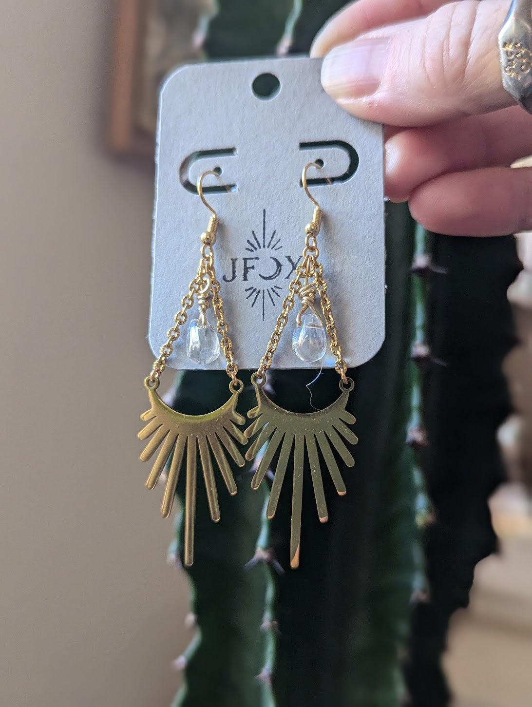 Rayo de sol con detalles en forma de lágrima de cristal (plata o dorada)