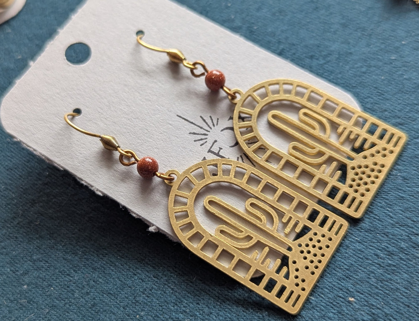 Brass Cactus Red Goldstone Arch Earrings