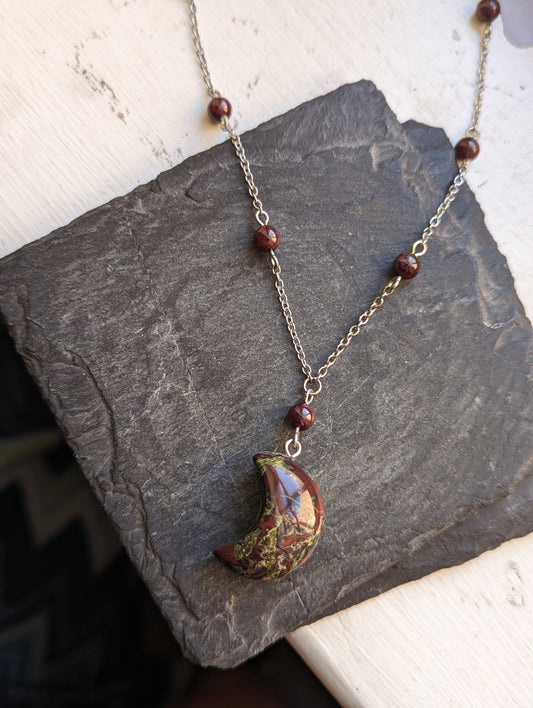 Dragons Blood Crescent Moon and Garnet on Stainless Necklace