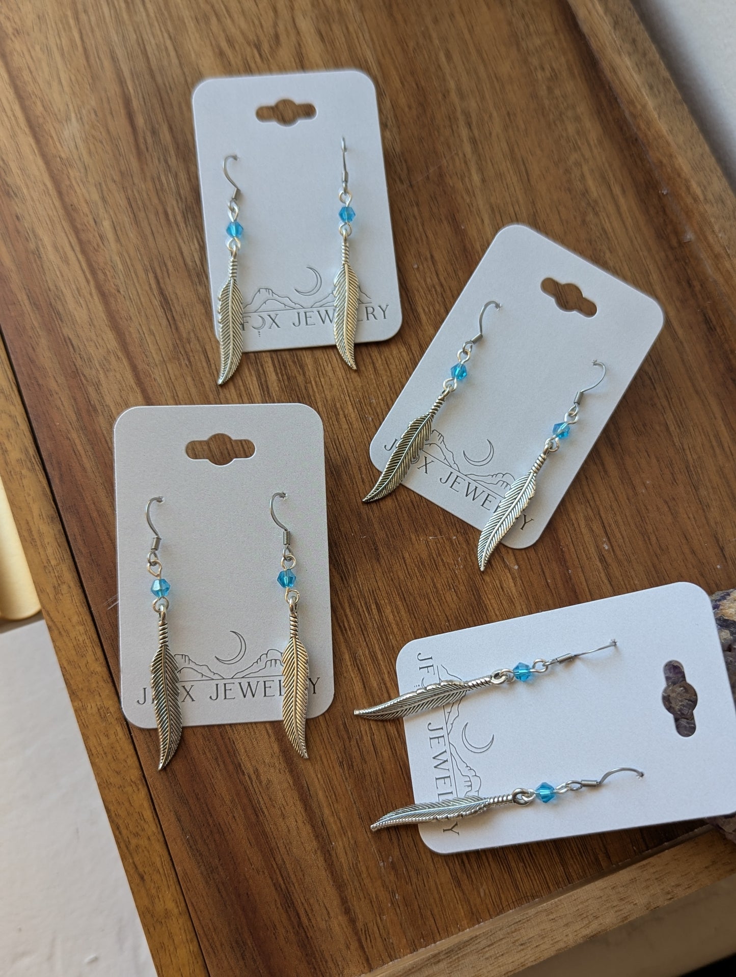 Silver Feather With Blue Accent Bead Earrings
