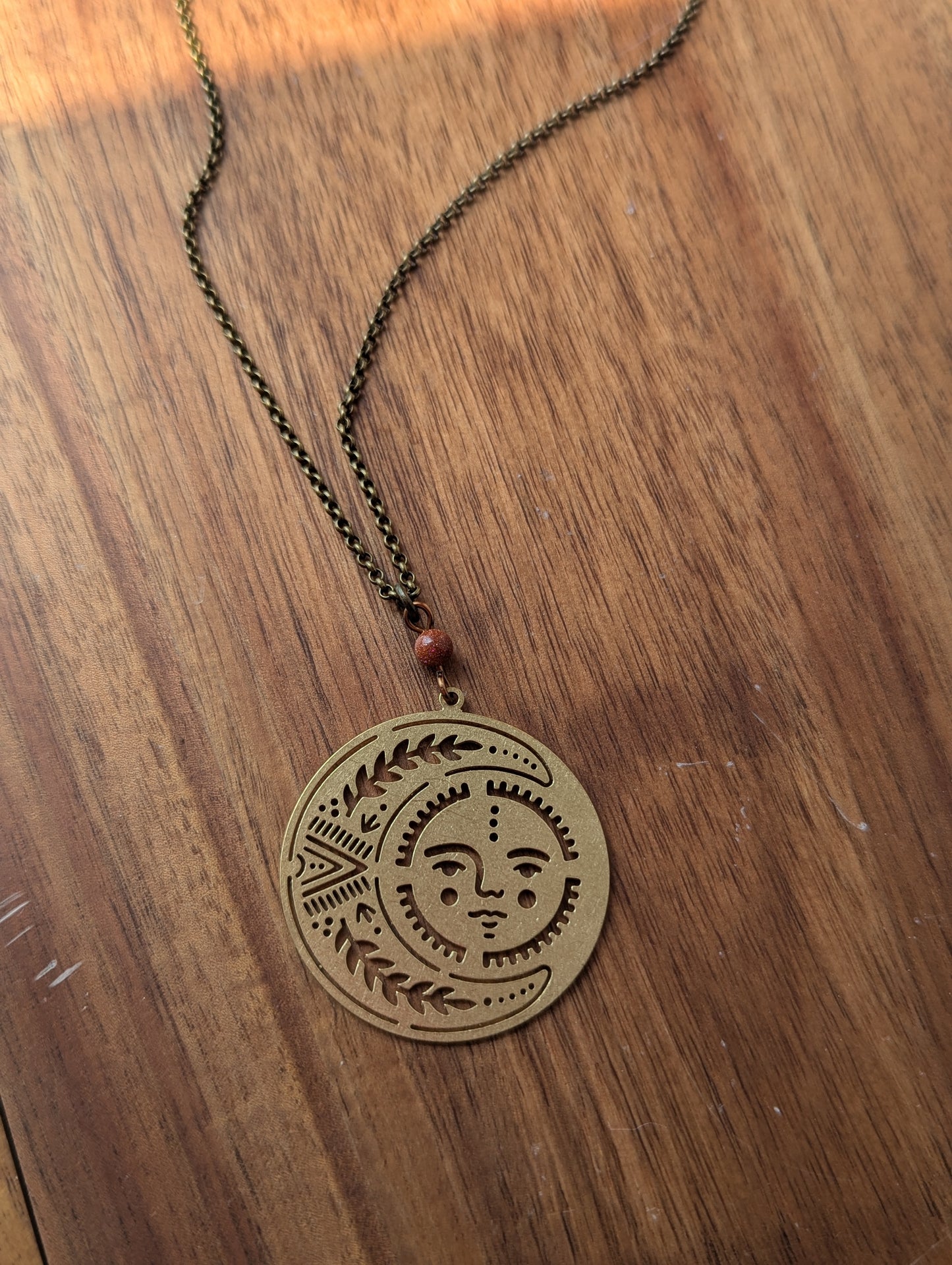 Brass Sun and Moon Red Goldstone Long Necklace