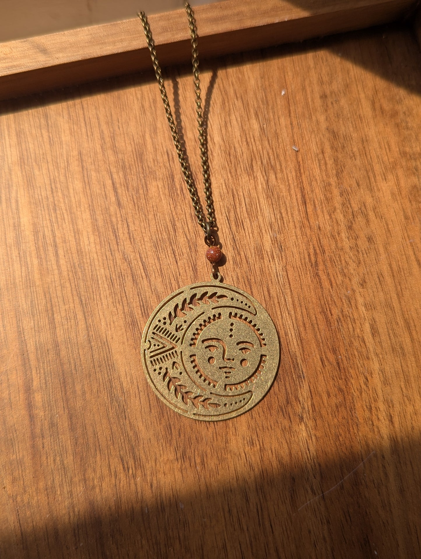 Brass Sun and Moon Red Goldstone Long Necklace