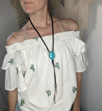 Vibrant Teal Blue Stone and Black Leather Bolo Tie