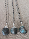 Emerald Pendant on Silver and Black Chain